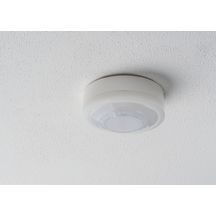 Détecteur de présence blanc 360°. IP 54. Contact renforcé 10 A. LED = max 400W. Montage en Fixation saillie plafond. Détection Diamètre 10 m à 2.5 m de haut. Réglage tempo 15 sec-30 min + impulsion. Réglage possible par télécommande. Réf. 1030062