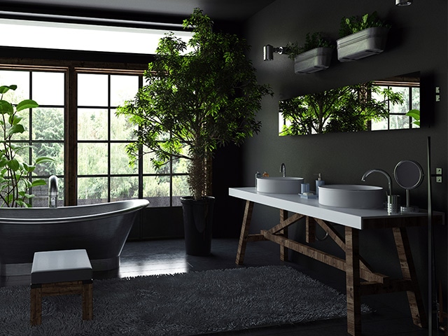 Salle de bain moderne dans les tons sombres